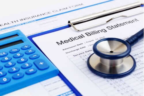 medical bill calculator and stethoscope