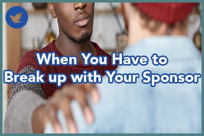 Indoor shot of warm-hearted young African American man showing compassion to unrecognizable male patting him on shoulder