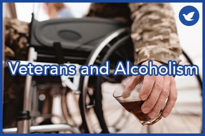 The veteran in a wheelchair is depressed. He has problems with alcohol. He holds a glass of whiskey.